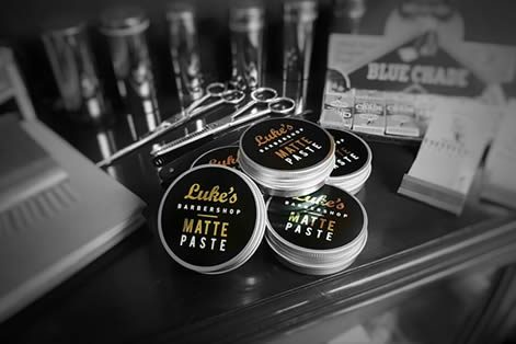 Tins of Luke's Barbershop matte paste.